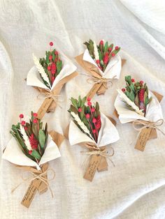 flowers are wrapped in brown paper and tied with twine on top of each other