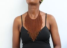 African beaded fringe necklace, Beaded Multi-strand necklace, Beaded Women necklace, Statement Necklace, Christmas gift for her, Moms gift An elegant necklace that can match any outfit. Handmade by the Maasai women in Kenya using fine beads. Color: Brown Dimensions:  Necklace length: 18 inches/ 46 cm Neck size: 15 inches / 38 cm 3-5 days delivery via DHL Express.  Pay shipping fee for the first item only and additional items ship for free. To view more items in our shop, kindly click here:  nkoroicrafts.etsy.com Beaded Fringe Necklaces With Round Beads As Gifts, Gift Necklace With Beaded Fringe And Round Beads, Beaded Fringe Necklace With Round Beads As Gift, Festival Multi-strand Brown Beaded Necklaces, Elegant Brown Multi-strand Beaded Necklaces, Bohemian Multi-strand Brown Beaded Necklaces, Bohemian Brown Multi-strand Beaded Necklace, Artisan Brown Multi-strand Beaded Necklace, Fringe Necklace