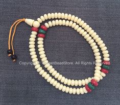 "Tibetan White Resin Mala Prayer Beads Quantity: 108 beads + 3 hole Guru Bead & Cap with Spacers Each bead varies slightly Item # PB210 Size: Approx 9mm wide x 5mm long (hole to hole) Please contact us if you have any questions. Thank you. \"LIKE\" Our Facebook Page for Store Updates & Special Offers: https://www.facebook.com/TibetanBeadStore Follow us on Instagram: https://www.instagram.com/TibetanBeadStore Please read the Store Policies and Shipping Information before placing an order. Adjustable White Wooden Beads, Adjustable White Mala With 8mm Beads, White 8mm Bohemian Beads, Hand-strung White Mala With Round Beads, White Hand-strung Mala With Round Beads, Traditional White Beaded Necklace With 8mm Beads, Traditional Hand-strung White Beads, 108 Bead, Coral Turquoise