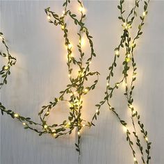 a string of lights that are on the side of a wall next to each other