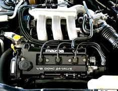 the engine compartment of a car is shown