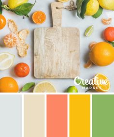 a cutting board with lemons, oranges and limes on it next to other citrus fruits