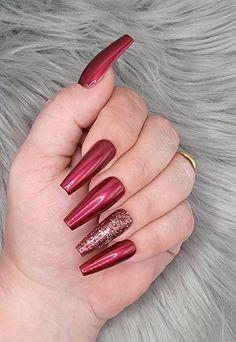 Please read full description These nails are the most beautiful shade of wine red I've ever seen. The ring finger is accented with a gold glitter that goes great over the red. They are shown in a long length, coffin shape, but can be made in multiple shapes, sizes, and lengths.  I offer hand-painted press-on nails made with mostly gel polish. Gel polish will give you longer lasting nails with no chipping. All of my sets are handpainted by me. I do not order wholesale or mass produced nails to re Gold And Red Nails Acrylic, Red Nails With Silver Glitter, Red And Golden Nails, Red Nails With Gold Glitter, Wine Colored Nails, December Nails Red, Red Velvet Nails, Red Sparkle Nails, Red Sparkly Nails