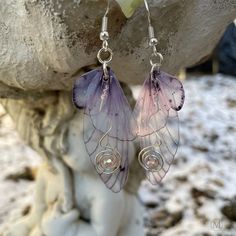 These beautiful dainty pink butterfly wing dangle earrings are the perfect addition to any fairy-inspired or ethereal look. The double wings design adds a touch of whimsy and movement, while the glittered top wing sparkles in the light. These fairy wing earrings feature copper or silver-colored swirled wires embellished with a pink crystal with a luster finish which catches the light in rainbow colors. These butterfly wings have three different ear wire selections to choose from, bare copper, ni Whimsical Clothing, Fun Fits, Fairy Wing Earrings, Butterfly Dangle Earrings, Pretty Accessories, Copper Plating, Dragonfly Wings, Butterfly Wing Earrings, Glitter Top