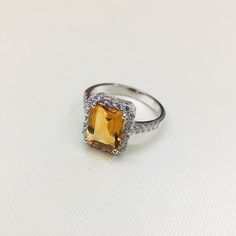 PRODUCT INFO : Stone : Natural Citrine Stone size : 8x10 MM Octagon Accent Stone : Cubic Zircon Metal type : Sterling silver (92.5) Approximate weight : 3.5 grams ABOUT CITRINE GEMSTONE : CITRINES have been valued for their beauty and brilliance. They remind us of the bright, warm sun and the vitality of life. Their vibrant yellow color and shining clarity often represent a healthy mind and body as well as happiness and success. These stones evoke images of sunny warmth and illumination, and it' Gemstone Ring Silver, Green Amethyst Ring, Zircon Ring, Citrine Stone, Citrine Ring, Citrine Gemstone, Round Rings, Proposal Ring, Moonstone Ring