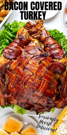 bacon covered turkey on a platter surrounded by other dishes and garnished with parsley