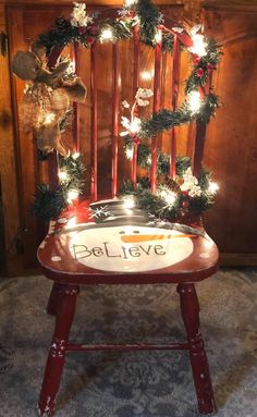 an old chair decorated for christmas with lights