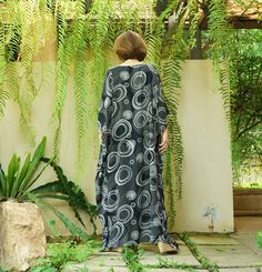 "A soft, comfy, printed light rayon maxi kaftan. A must have piece for this summer. Team this dress with sandal and a big tote to complete a casual chic, or wear it to a garden party, Sunday brunch and beach party. Material: printed light rayon Model is 161 cm. tall with 32\" bust, 28\" waist and 38\" hip Status: ready to ship weight: 315g Measurement: dress (approximately) Width: 43.5\" Bust: 65\" **can fit up to bust max 52\" Hip: 65\" **can fit up to bust max 52\" Length: 52.5\" PLEASE PROVID Casual Rayon Kaftan For Vacation, Casual Loose Maxi Dress For Vacation, Flowy Loose Maxi Dress For Vacation, Black Flowy Rayon Maxi Dress, Black Relaxed Fit Maxi Dress, Casual Rayon Kaftan For Beach, Casual Black Printed Beach Dress, Casual Black Flowy Beach Dress, Casual Summer Rayon Kaftan