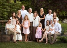 a large family is posing for a photo