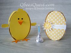 an easter egg with a chick on it and a candy bar in the shape of an egg