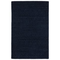 a dark blue rug on a white background