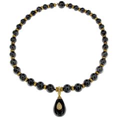 Elegance and style converge in this stunning necklace, inspired by French fashion from the 1970s. This piece features a large strand of hematite beads, beautifully complemented by diamond and yellow gold elements, offering versatile styling options for both casual and dressy looks. Features: Material: 18 Karat Yellow Gold and Hematite Beads Gemstones: 304 White Diamonds Design: Graduated hematite beads with gold and diamond elements, including a teardrop pendant in the front Total Necklace Lengt Fashion In France, Regular Necklace, Stylish Necklace, Pendent Necklace, Hematite Beads, Stunning Necklace, Diamond Design, Beads Necklace, Look Casual