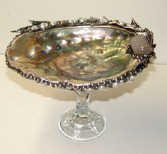 a silver bowl sitting on top of a table