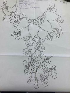 the back side of a piece of paper with an intricate design on it