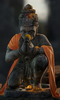 an image of a statue that is sitting on the ground with his hands clasped to his face