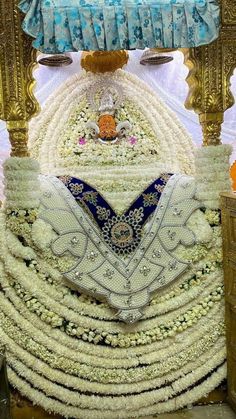 an elaborately decorated bed in the middle of a room