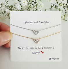 Mother and Daughter Necklace for Mom  Celebrate the lasting connection between a mother and child with this heartfelt heart charm necklace. Featuring a contemporary and dainty design, the necklace showcases a delicate 10mm CZ diamond pendant, gracefully hanging from a refined 16k gold-plated /  rhodium (silver). Versatile for everyday wear, it effortlessly enhances any ensemble with its understated elegance. This charming necklace is an ideal gift for Mother's Day, birthdays for daughters , or any significant occasion to express affection and gratitude. Perfect for not only mothers but also anyone dear to you, including yourself. Customization is available! Add a personalized message to make this gift even more special, creating a treasured keepsake that strengthens your connection with yo Double Heart Jewelry For Birthday And Mother's Day, Double Heart Jewelry For Birthday Gift And Mother's Day, White Heart Necklace With Birthstone For Mother's Day, White Birthstone Heart Necklace For Mother's Day, White Heart Necklace For Mother's Day Gift, Mother's Day White Heart Necklace Gift, Mother's Day Jewelry With Heart Charm For Birthday Gift, Heart Cut Necklace For Birthday And Mother's Day, Heart Cut Necklace For Mother's Day And Birthday