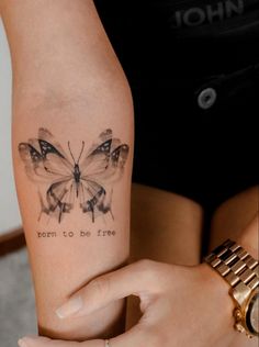 a woman's arm with a butterfly tattoo on it and the words, mom to be free