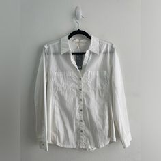 Eileen Fisher Classic White Button Down Collared Poplin/Pajama Style Long Sleeve Shirt, Size S. New With Tags. Classic, Sustainable, Eco, Organic Cotton, Timeless, Mature, Staple, Lagenlook, Minimal Flaws To Note: Small Marks/Stains On Front Left Small Mark On Right Collar Small Hole Close To Inside Style Tag All As Shown In Photos. Features: Button Up / Button Down Collar Mother Of Pearl Style Iridescent Buttons Two Chest Pockets - Poplin Pajama Shirt Style Subtle U Hem Unique Mixed Media Garme Relaxed Fit Button-up Sleepwear, Casual White Button-up Sleepwear, Casual Cotton Button-up Sleepwear, Casual Cotton Sleepwear With Button Closure, Spring Button-up Sleepwear With Pockets, Collared Cotton Sleepwear With Button Closure, Casual Spring Button-up Sleepwear, Casual Long Sleeve Sleepwear With Button Closure, Casual Sleepwear With Buttons In Relaxed Fit