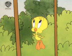 an image of a cartoon character peeking out from behind some trees and bushes in the background