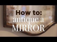 an antique mirror hanging on the wall with text overlaying it that reads how to antique a mirror