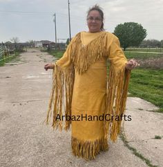 Handmade Western Style Long Wedding Dress Powwow Regalia Suede Leather Dress Native Womens Leather Maxi Native American Womens Coat Dress Features: *         100 % genuine top quality Suedeleather. *         Tan Brown color  *         Lining Material : Polyester *          Long Fringes *         Stitched work  For Your Best Fit: I Need Your Below Sizes -Neck: -Shoulder to shoulder: -Sleeves Length -Chest: **Custom orders after manufactured on demand so return or exchange is not acceptable** -------------------------- DELIVERY DETAIL -------------------------- All of our orders are made on-demand, tailored according to your measurements for a better fitting and exquisite look. Import Custom Duties and Taxes! The Buyer is fully responsible for any import customs duties and taxes in his count Native American Wedding Dress, Grass Dance Outfits, Buckskin Dress, American Indian Clothing, Native American Wedding, Powwow Regalia, Long Wedding Dress, Native Dress, Native American Clothing