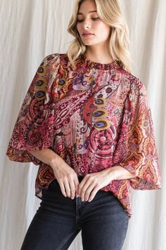 Paisley long sleeve blouse. Has a frill mock neck and a key hole back. Features the balloon sleeve with a smocked cuff we love. lined and non sheer. Fits True to size. High Neck Top, Fall For You, Key Hole, The Balloon, No Frills, Mock Neck, Shirts Tops, Bell Sleeve Top, Sleeve Blouse