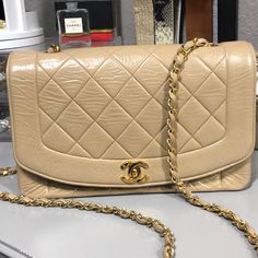 Vintage Authentic Chanel Diana Bag Beige With Gold Strap Lambskin Leather (See Photos For Leather Condition) Bottom: Great Condition Interior: Great Condition (No Staining) Kept In Sleeper Bag, No Authenticity Card But Poshmark Will Authenticate. Keep In Mind This Bag Is Vintage And At Least 30 Years Old. Chanel Diana Bag, Vintage Chanel Bag, Bags Vintage, Chanel Purse, 30 Years Old, Chanel Bags, Vintage Chanel, Lambskin Leather, 30 Years