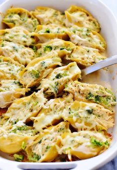 a casserole dish with broccoli and chicken in it, ready to be eaten