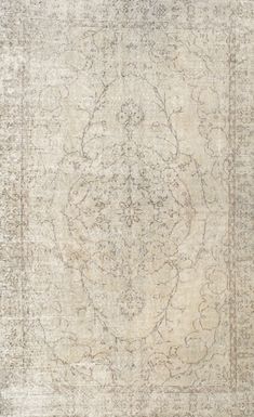 an antique rug is shown in beige and grey tones with intricate designs on the border