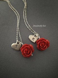 Red rose necklaces with hand stamped initial heart for best friends. Red rose and heart charm are on an 18'' stainless steel chain with lobster clasp. *This price is for 2 necklaces *Stainless steel chain *Stainless steel heart *15mm red rose *Handmade with love <3 Like Jmesjewelrybox on Facebook for updates on new jewelry, upcoming sales and giveaways! Plus Facebook fans save 5% :D Find the coupon code on Jmesjewelrybox's cover photo https://www.facebook.com/Jmesjewelrybox Red Flower Charm Jewelry For Valentine's Day, Valentine's Day Initial Pendant Charms Jewelry, Personalized Dangle Charm Necklaces For Valentine's Day, Valentine's Day Stainless Steel Necklace, Valentine's Day Charm Necklace With Initial Pendant, Dainty Personalized Red Charm Necklaces, Valentine's Day Sterling Silver Rose Jewelry, Personalized Red Dangle Jewelry, Dainty Red Personalized Charm Necklaces