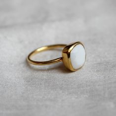 D E T A I L S - Material: 925 Sterling Silver Stone: White Agate The fit: True to US ring size Finish: Smooth and Gold Plated to a high shine S H I P P I N G & P R O D U C T I O N - My current production time is 2-6 business days, which means after those days are up, your order ships! I make everything custom to order, by hand, but I promise you it's worth the wait! R U S H - M Y - O R D E R - If you're in a rush to get your pretty new pieces, please send me a message and I'll let you know j Adjustable White Rings With Polished Finish, White Adjustable Rings With Polished Finish, White Stackable Rings With Polished Finish As Gift, White Polished Stackable Rings For Gift, White Polished Finish Stackable Rings For Gift, White Opal Ring With Polished Finish For Gift, White Enamel Ring With Gemstone For Anniversary, White Opal Ring With Polished Finish As Gift, White Opal Ring With Polished Finish