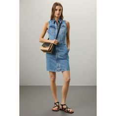 Blue denim (99% Cotton, 1% Elastane). Casual dress. Sleeveless. Collared neckline. Front zipper closure. 34" from shoulder to hemline. Imported. Sleeveless Denim Blue Top For Work, Dark Wash Sleeveless Denim Top For Work, Casual Sleeveless Denim Dress With Zipper Closure, Sleeveless Blue Denim Top For Work, Denim Blue Dresses With Zipper Closure, Casual Medium Wash Dress With Zipper Closure, Casual Medium Wash Dresses With Zipper Closure, Denim Blue Workwear Vest For Summer, Denim Blue Denim Vest For Summer Workwear