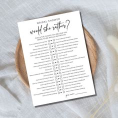 the bridal shower word and checklist on a wooden plate