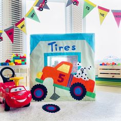 a room filled with toys and decor on top of a white floor next to a window