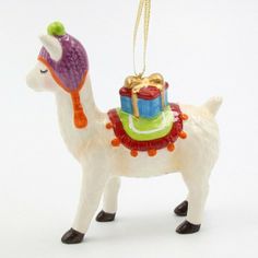 a llama ornament with a gift on its back