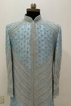 This raw silk material Sherwani comes in any colour of your choice with silver heavy hand embroidery all over it. This Hand Embroidered attire is Enhanced with Resham, Zari, Bullion and Stone Work and is Crafted in Chinese Collar Neck and Full sleeves. Includes- sherwani with pants. Customisation available. Base colour of sherwani can be customised according to customer choice . Hand Embroidery Sherwani Men, Sherwani Hand Work Design, Best Wedding Suits For Men, Best Wedding Suits, Wedding Dresses Men Indian, Sherwani Groom, Hand Work Design, Abstract Embroidery, Chinese Collar