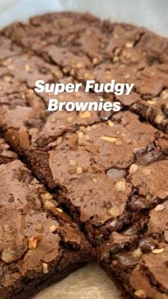 brownies cut into squares and stacked on top of each other with the words super fudgey brownies above them