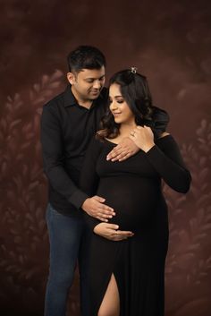 a pregnant couple standing next to each other