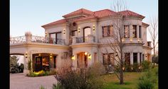 a large house with lots of windows and balconies