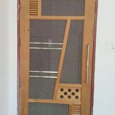 the door is made out of wood and has metal grates on it's sides