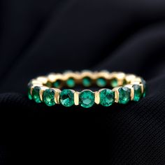 Product Details As you pick up your favorite green dress, complete your look with this stunning Created Emerald Ring. The band ring is designed with a Full Eternity Band featuring Round Cut Created Emerald stones in a Bar Setting, weighing a total of 5.25 Carats with AAAA Quality. Product Information SKU SHP-RINGS052182340 Width 3.5 mm Height 2.5 mm Weight 3.12 gm (Approximate) LAB CREATED EMERALD INFORMATION No.of Stones 19 Pieces Total Weight 5.13 Carat (Approximate) Dimension(approx) Round-4X4 mm-19 Pcs Color Green Cut Brilliant Shape Round Setting Type Bar-Setting Quality Grade AAAA View More Product Parent Collection Handle eternity-rings Bar Setting, Inexpensive Jewelry, Lab Created Emerald, Gold Aesthetic, Eternity Band Ring, Signature Jewelry, 18k Yellow Gold Ring, Emerald Stone, Timeless Jewelry