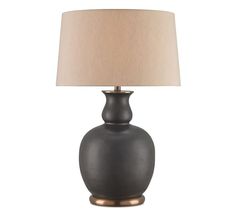 a black lamp with a beige shade on it