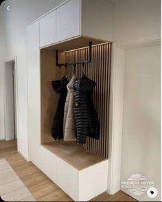 a coat rack in the corner of a room