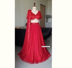 Made to Order/Measurement/Custom Order Lehenga - Color : Red - Fabric : Net - Fully flared soft net gathered lehenga skirt with embroidered waistband - Embroidered Net scallop V Neck blouse - Red soft net dupatta with border - Drawstring closure with Tassels - Can can attached PLEASE NOTE: BUYERS ARE RESPONSIBLE FOR ANY CUSTOMS AND IMPORT TAXES THAT MAY APPLY. Fabric Care : Dry Clean Only Disclaimer: Please note the photographs are taken by mobile camera in sunlight The actual color of the produ Formal Red Organza Sets, Red Lehenga For Formal Festive Occasions, Red Fitted Lehenga For Party Wear, Red Fitted Choli For Formal Occasions, Formal Red Fitted Choli, Formal Fitted Red Choli, Formal Red Lehenga With Sheer Dupatta, Formal Red Lehenga With Dupatta, Bridesmaid Lehenga