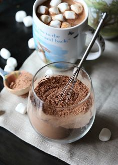 hot chocolate in a mug with marshmallows on the side