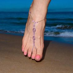 Homemade barefoot sandals. They may be too late to wear to  the lake this year but not too late  for vacations to warm places.  The foot jewelry is made with a stretch cord and fits shoe sizes 7.5 to 9. They can be remade to your shoe size. The sandals are made with purple acrylic beads and gold glass beads. Adjustable Purple Anklets, Handmade Gold Barefoot Sandals For Vacation, Bohemian Gold Barefoot Sandals For Vacation, Gold Bohemian Barefoot Sandals For Vacation, Adjustable Purple Sandals For Beach, Purple Adjustable Sandals For Party, Adjustable Gold Barefoot Sandals For Beach, Adjustable Gold Sandals For Beach Season, Pink Adjustable Barefoot Sandals