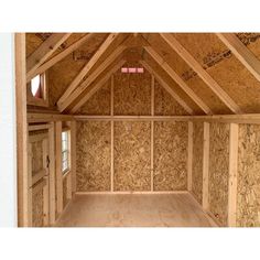 the inside of a house with wood framing on the walls and ceiling is covered in plywood