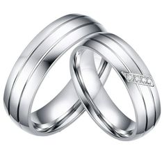 two white gold wedding rings with diamonds