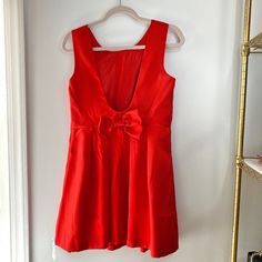 New With Tags Fit And Flare Dress Brand: Just Me, From: Red Dress Boutique Color: True Red, Size: Medium Sleeveless Open Back (U Shaped) Adorable Bow Centered On The Back! Flattering Pleats Dress Is Lined Hidden Zipper On The Side Perfect For The Upcoming Holiday Season! Measurements Laying Flat From Seam To Seam: Chest: 16.5in, Waist: 15.5in, Sleeve Width: 2.5in, Length: 32.5in Shell And Lining Are 100% Polyester *Color May Vary Slightly From Picture To Picture Compared To The Actual Item* Red A-line Mini Dress For Holiday, Red A-line Mini Dress, Red A-line Mini Dress Lined, Red A-line Mini Dress With Lining, Red Holiday Dress With Red Bow, Holiday Red Dresses With Red Bow, Red Sleeveless Lined Mini Dress, Red A-line Mini Dress For Spring, Red V-neck Lined Mini Dress